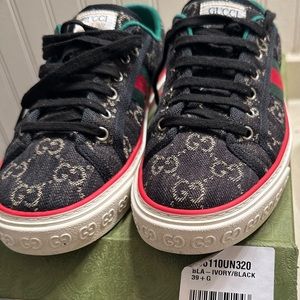 The Gucci Tennis 1977 Black and ivory Gucci denim jacquard tennis shoe.